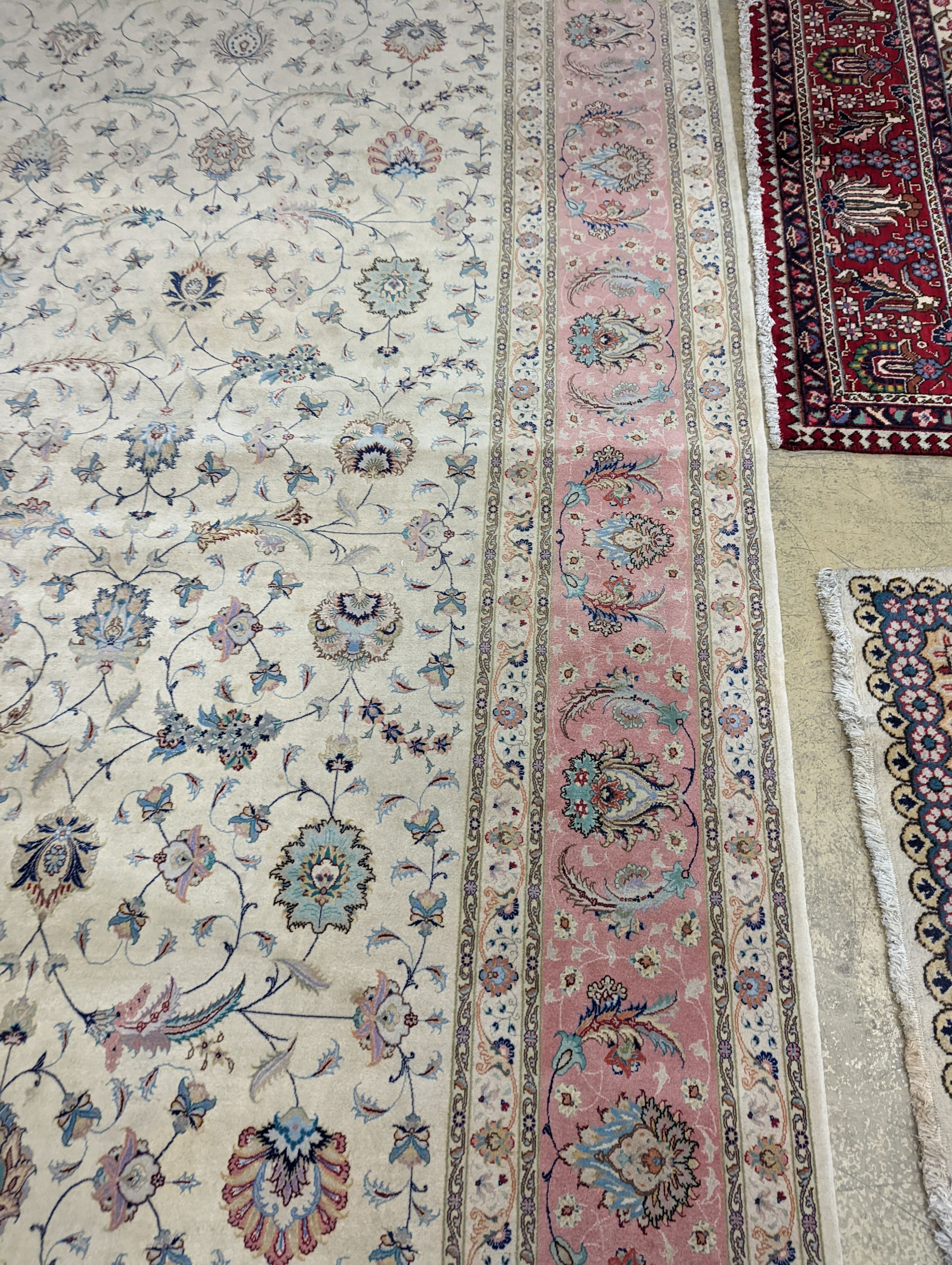 A Persian Tabriz ivory ground carpet, 410 x 300cm